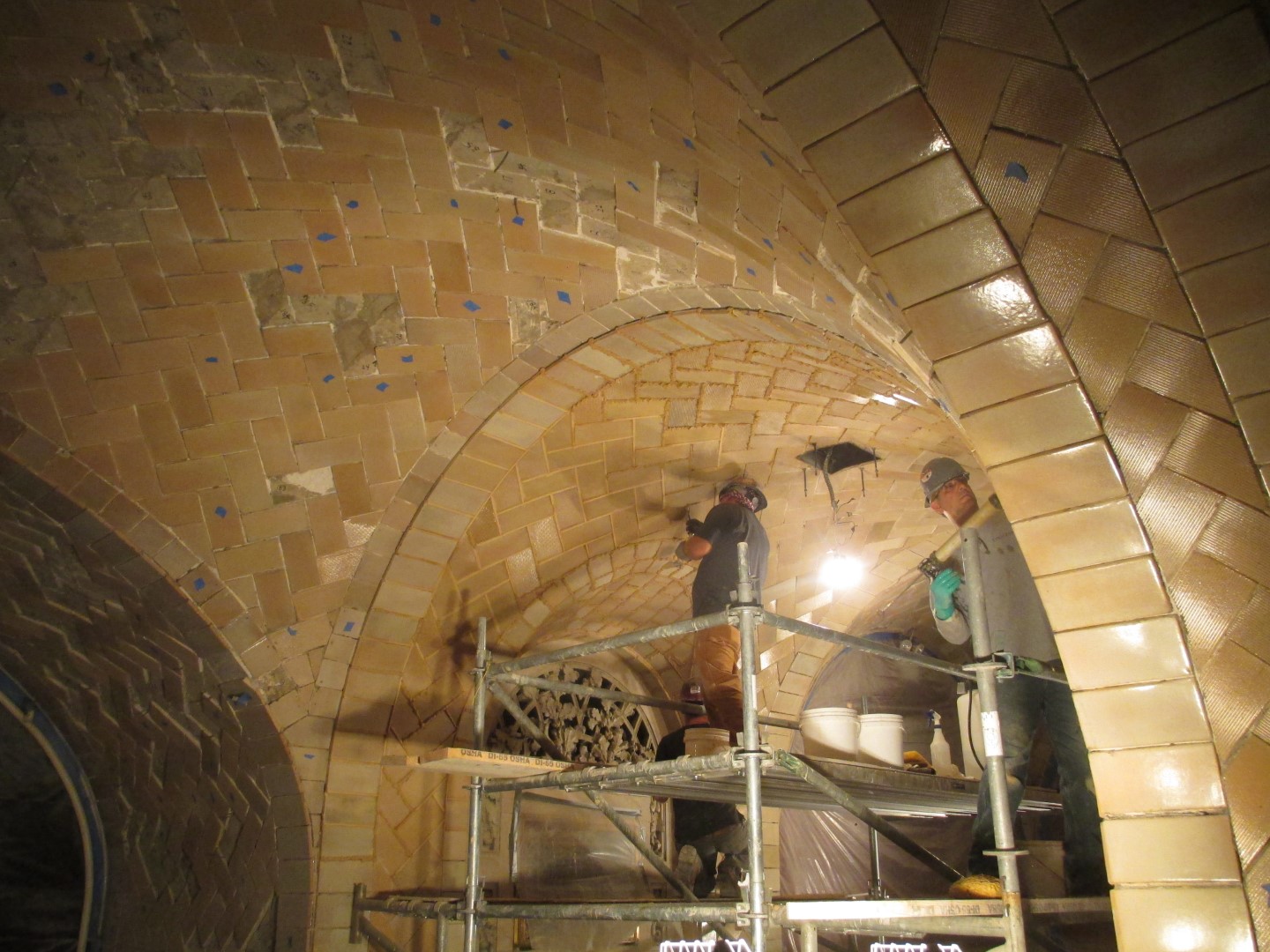 men working on the ceiling of the Oyster Bar