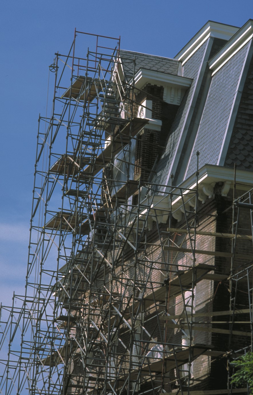 scaffolding outside of a large house