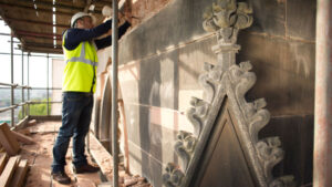 Local Law 11- Why Its Important - Masonry restorer works on building