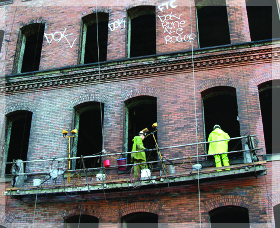Graciano crew on swing stage cleaning Cork Factory facade